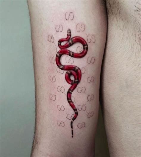 gucci snake tattoo on arm